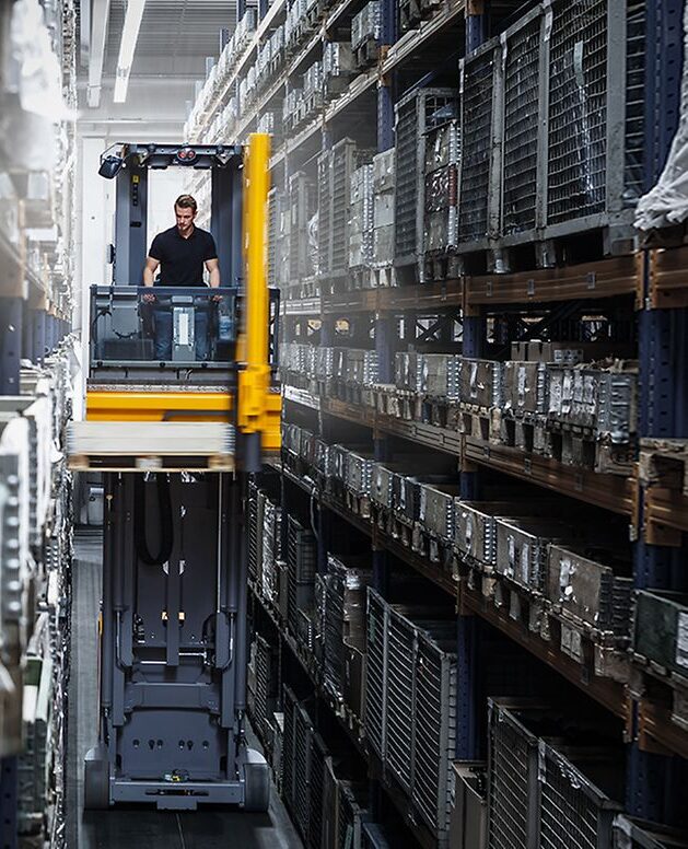 stage-very-narrow-aisle-trucks Toyota VNA forklift operating in tight warehouse spaces Linde VNA forklift for optimized storage solutions in Pakistan BT VNA forklift – narrow aisle efficiency and performance High-reach VNA forklift with durable tyres – Ghazi Motors Pakistan Electric VNA Machines in Pakistan for modern warehouse management systems